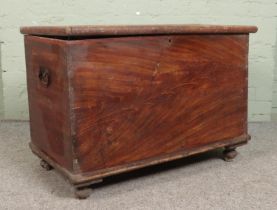 A painted pine toolchest/blanket box, with candle compartment. Height: 68cm, Width: 94cm, Depth: