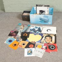 One box and one carry case of vinyl records and singles to of mainly pop and easy listening to