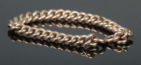 A gold curb link chain, 18cm long. Tests as 9ct. 10.8g Missing clasp.