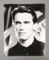 An Arnold Schwarzenegger signed monochrome photograph.