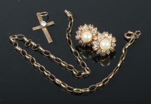 A 9ct gold diamond cross pendant with with 9ct gold rolo link bracelet and a pair of yellow metal