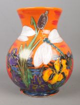 An Anita Harris Dragonflies, Iris and Reed vase on orange background. Stamped and gold signed to