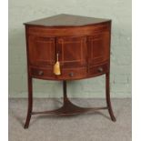 A Victorian mahogany inlaid corner wash stand, with cupboard door over singular draw flanked by to