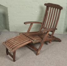 A teak and brass Paul Reef garden patio lounger.