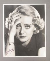 A Bette Davis signed monochrome photograph dated for 1988.