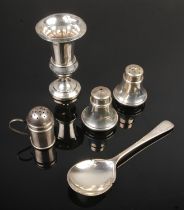 A small quantity of silver including salt and pepper shakers, posy vase, sugar shaker and silver