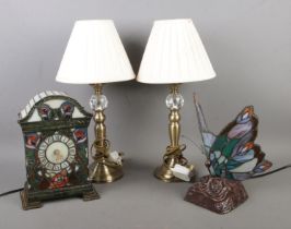 A collection of table lamps to include stained glass butterfly and mantle clock.