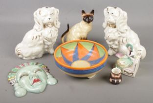 A collection of ceramics. Includes Art Deco style wall plaque and bowl, mantel dogs, Goebel etc.