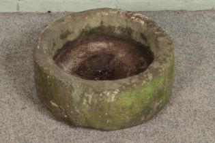 A small reconstituted stone trough. Hx18cm Dx43cm