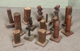 A collection of wooden stands. Includes turned, naturalistic and twist examples.