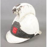 A painted Merryweather style helmet with flaming grenade motif to the front.