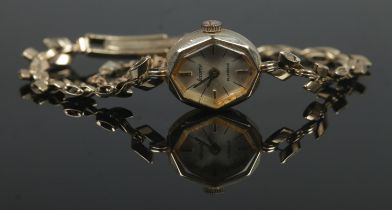 A ladies 9ct Gold Accurist manual wind wristwatch, featuring silvered dial, baton marks and 21 jewel