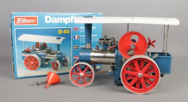 A boxed Wilesco D40 live steam 'Dampftraktor', in blue with red wheels and white roof in original