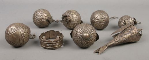 A collection of eight white metal Portuguese/Afro-Brazillian 'Balangandan' charms.