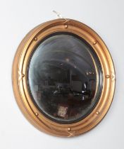 A gilt framed circular convex mirror. 32cm diameter.