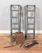 A pair of car ramps along with a vintage petrol can, jack and Dunlop Major footpump.