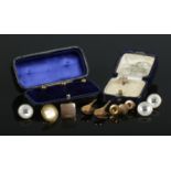 A collection of gold and yellow metal studs, including a cased set of three 15ct Gold and odd 9ct