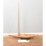 A large vintage motorised kit model of a pond yacht on display stand. Approx. dimensions 115cm x