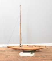 A large vintage motorised kit model of a pond yacht on display stand. Approx. dimensions 115cm x