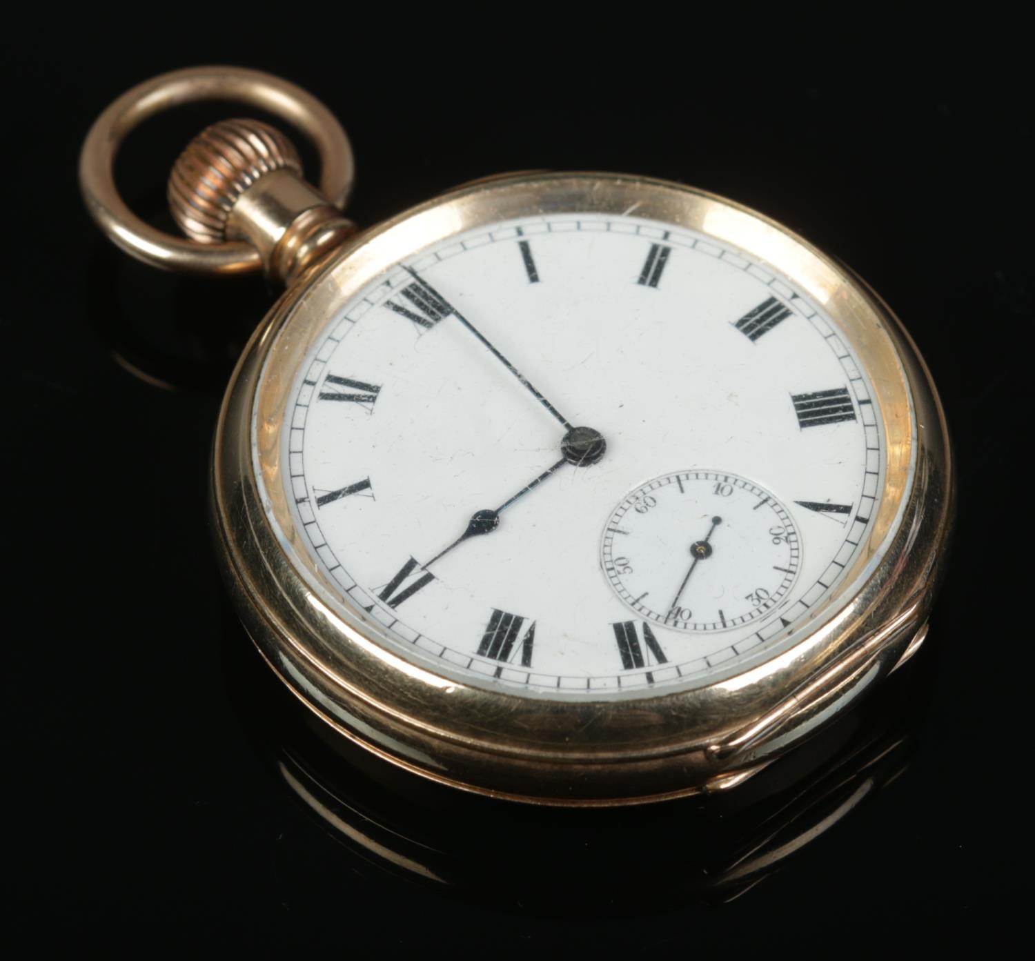 A gold plated open face pocket watch, with Roman Numeral face and subsidiary second dial. The 19