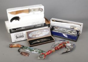 A collection of decorative knives many boxed and in new condition mostly of Native American theme