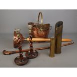 A small collection of metal and wooden collectables including a pair of brass and wood candlesticks,