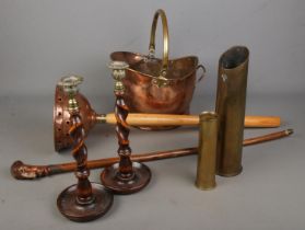 A small collection of metal and wooden collectables including a pair of brass and wood candlesticks,