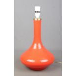 An orange glass table lamp. Height 34cm.