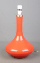 An orange glass table lamp. Height 34cm.
