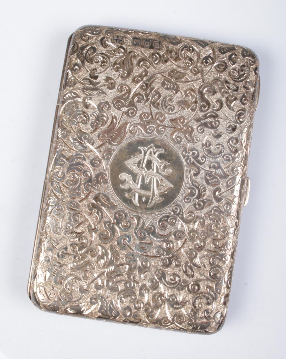 A Victorian silver evening purse by Sampson Mordan & Co. featuring heavily decorated floral exterior