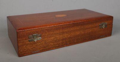 A mahogany cased six piece silver backed vanity set; the case bearing central fan patera inlay.