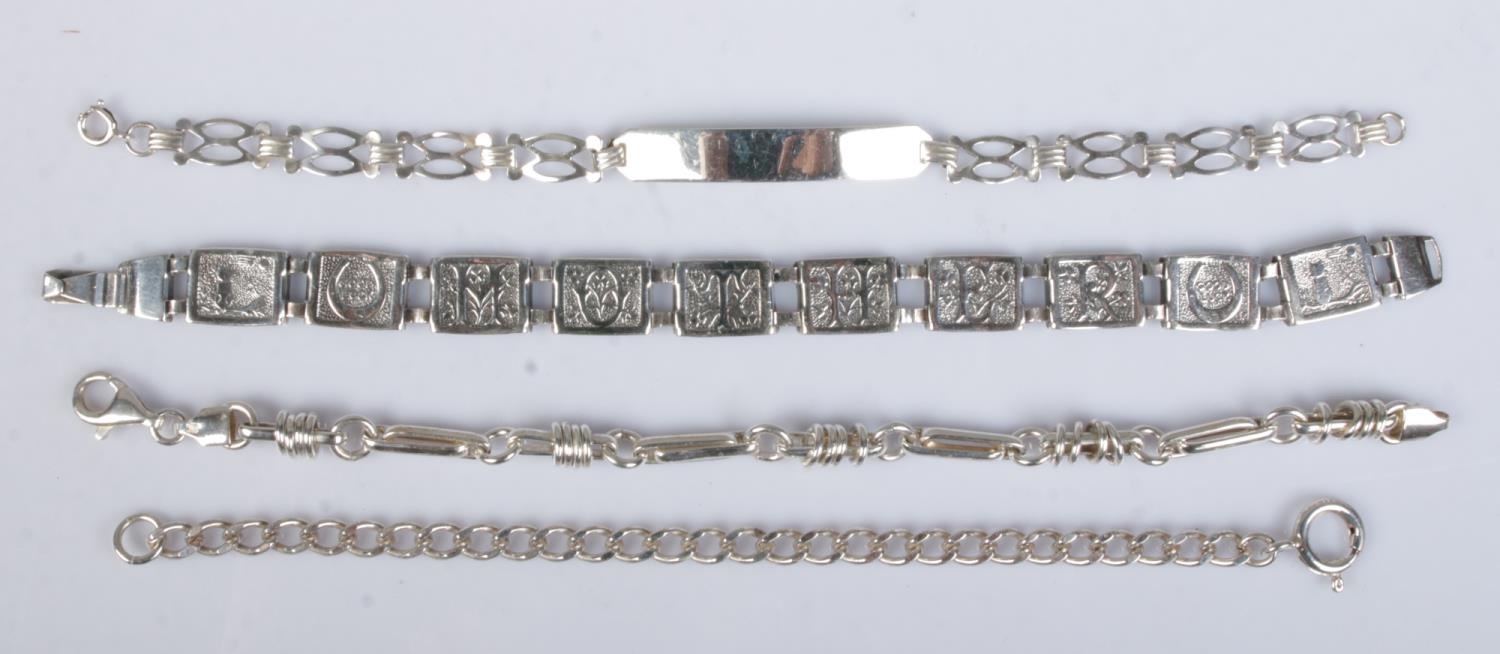 Four silver bracelets. Includes curb example, 'Mother' panel example etc.