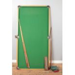 A 6' x 3' table top snooker table, with tubular steel frame, together with snooker balls and cues.