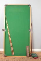 A 6' x 3' table top snooker table, with tubular steel frame, together with snooker balls and cues.