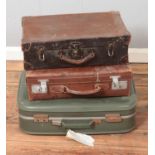 Three vintage leather and cloth suitcases to include antler example.