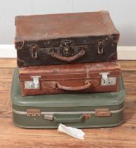 Three vintage leather and cloth suitcases to include antler example.
