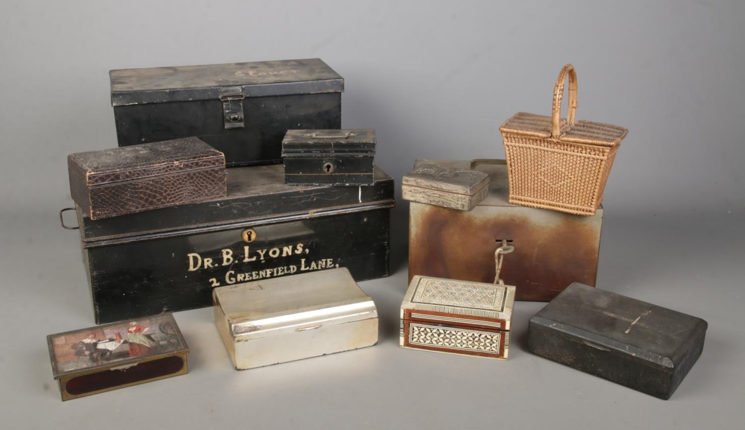 A collection of assorted boxes, to include strong box with key, jewellery boxes and white metal