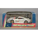 A boxed Hornby Scalextric Porsche 911 race car.