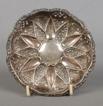 An early Twentieth Century silver pin dish, with pierced detailing to sides and central sunflower