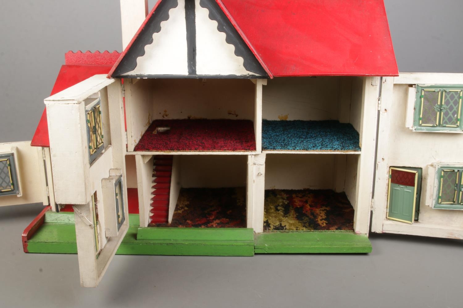 A vintage two storey dolls house with furniture. - Image 2 of 3