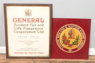 A painted railway sign on board depicting the LMS insignia, together with a framed fire and life