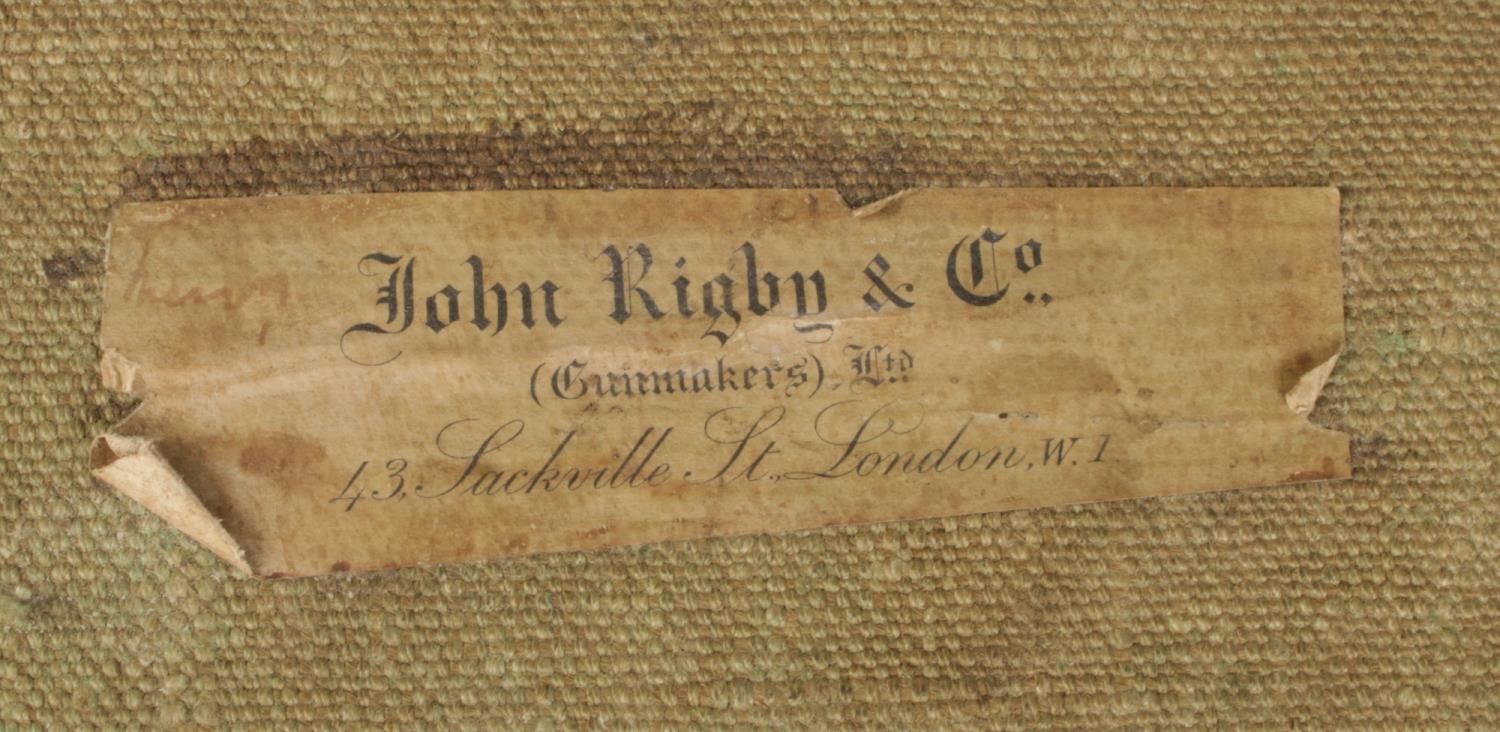 An antique green canvas and leather gun case. Bears label for John Rigby & Co. - Image 3 of 4