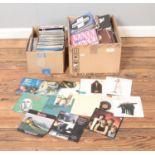 Two boxes of assorted vinyl singles of mainly pop and rock to include Elvis Presley, Peter