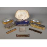 A collection of dressing table silver and silver mounted items. To include powder compact,