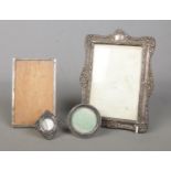 Four silver mounted photo frames, of various sizes. Easel back missing from largest example.