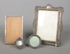 Four silver mounted photo frames, of various sizes. Easel back missing from largest example.