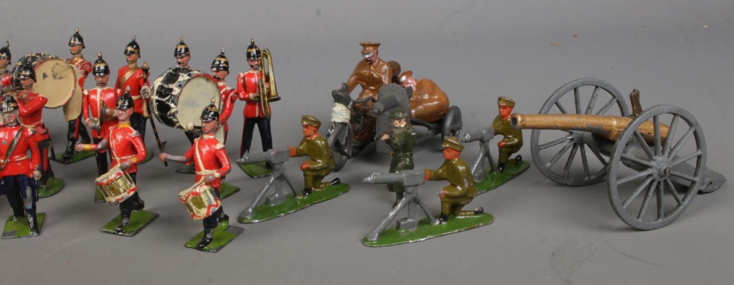 A collection of lead soldier figures, including Britains examples. Features marching band, cannons - Image 4 of 6