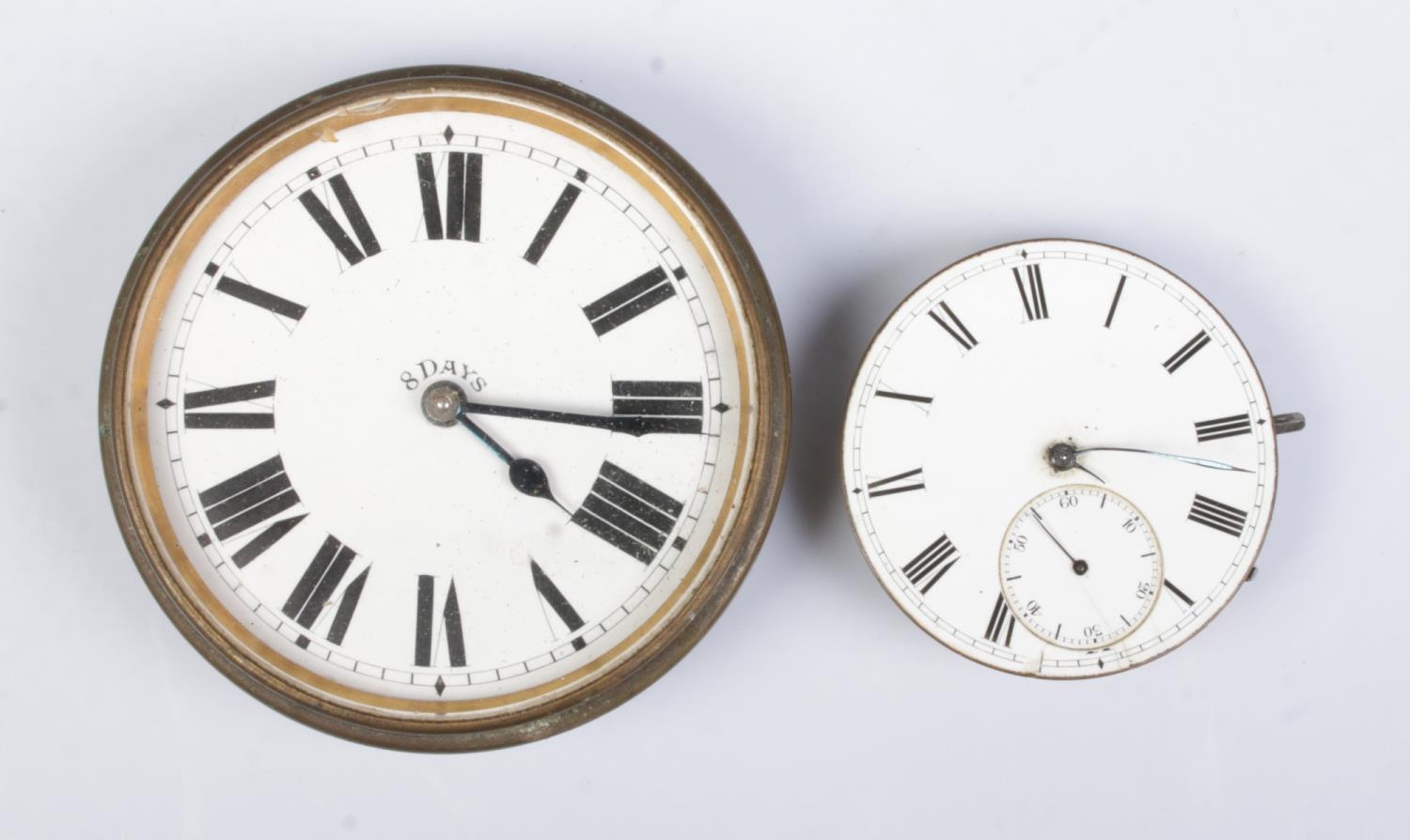 A white metal Goliath type pocket watch along with a JW Benson pocket watch movement. Goliath