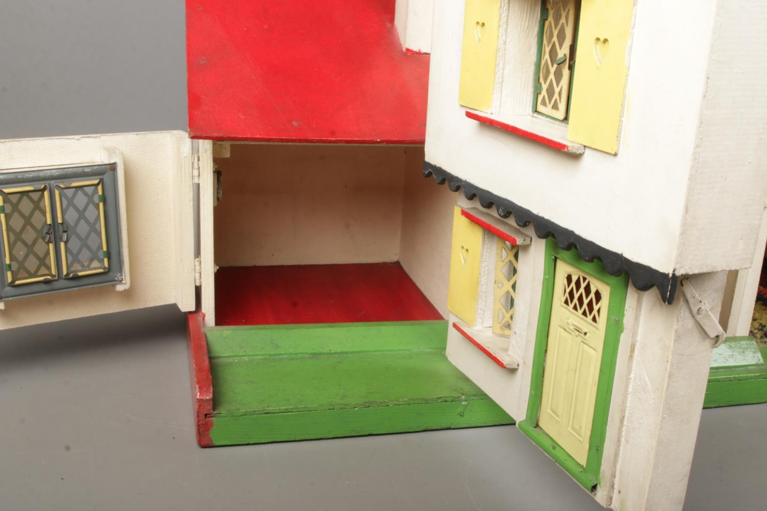 A vintage two storey dolls house with furniture. - Image 3 of 3