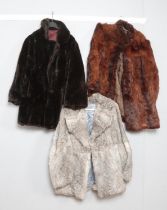 Two vintage fur coats along with a French simulated fur example.